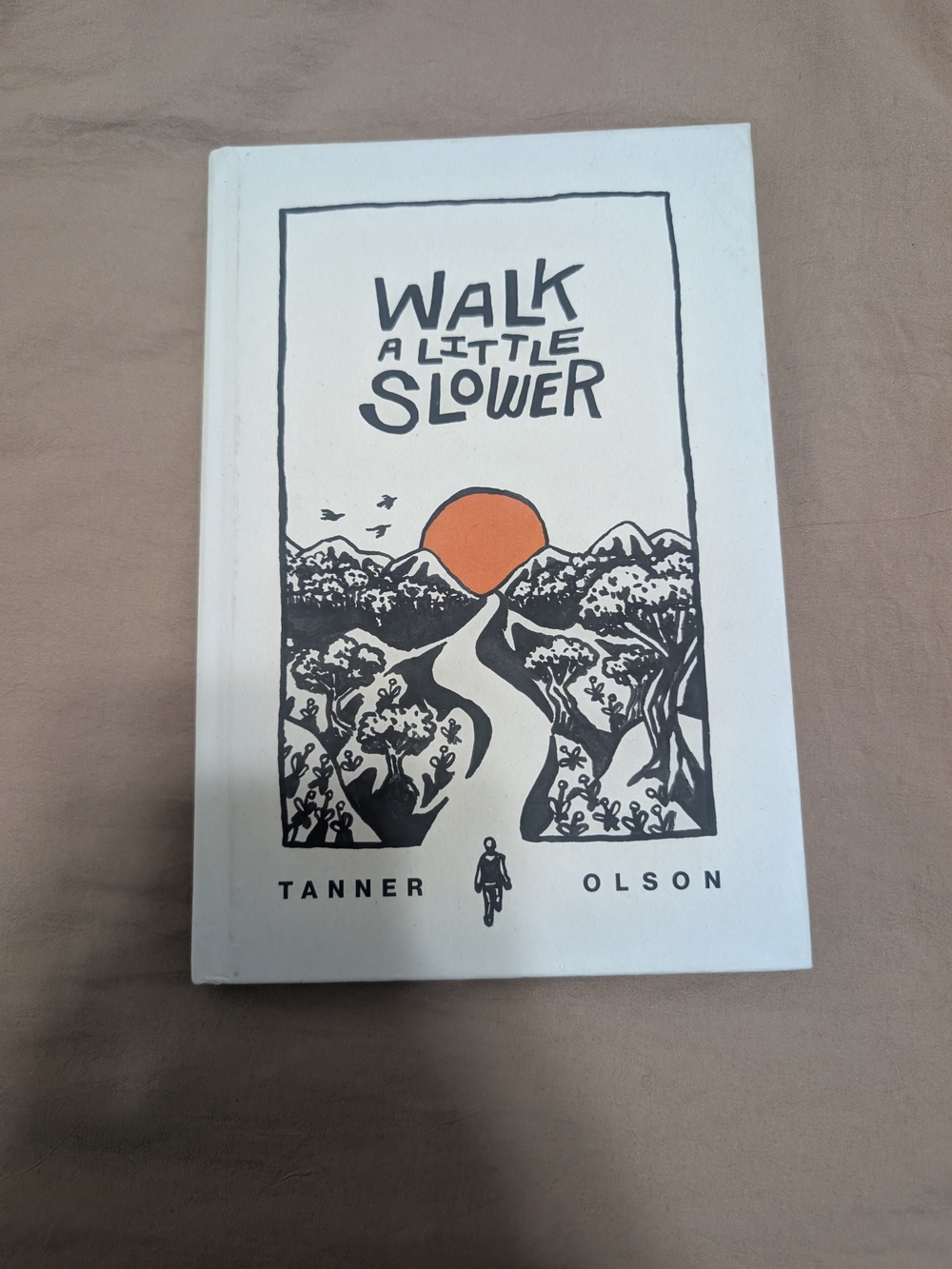 Walk a Little Slower by Tanner Olson - White Cover with Orange Accent